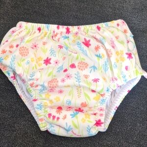 NWOT iPlay reusable swim diaper. 18 months. Never worn. White with flowers.